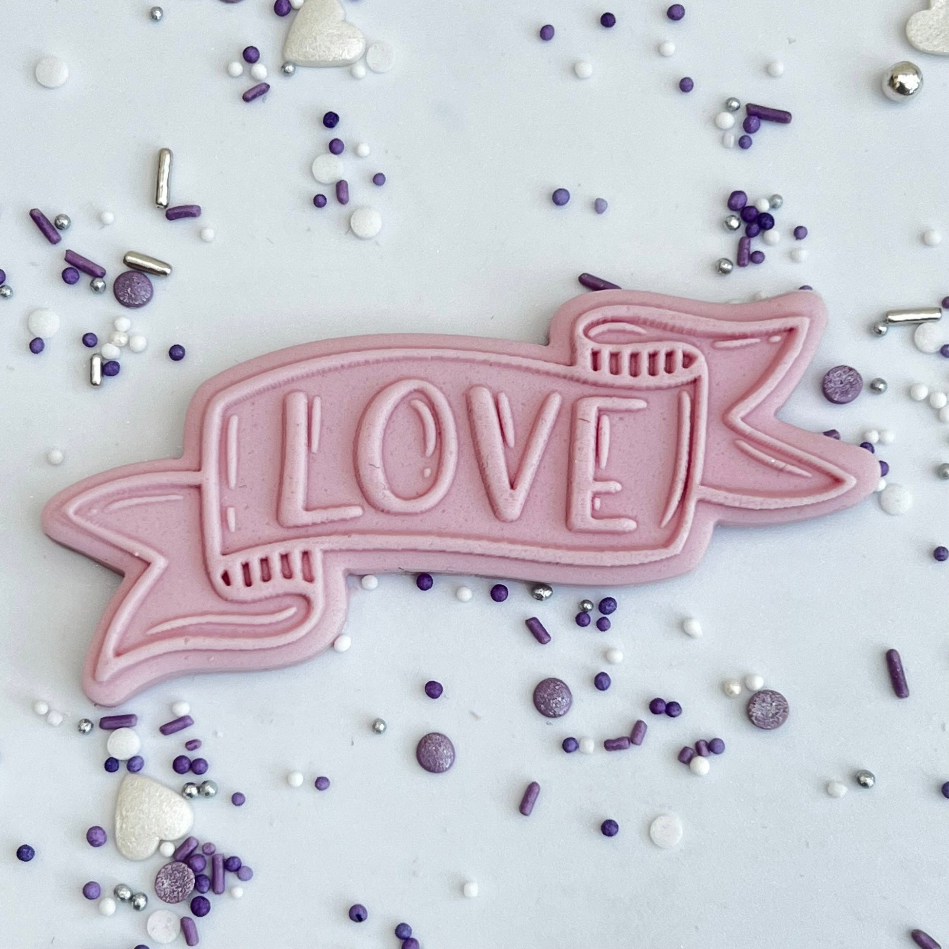 Love on a ribbon -  DeBoss and Cutter image 0